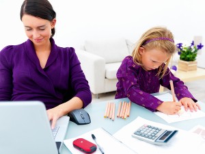 Young woman or mother working from home