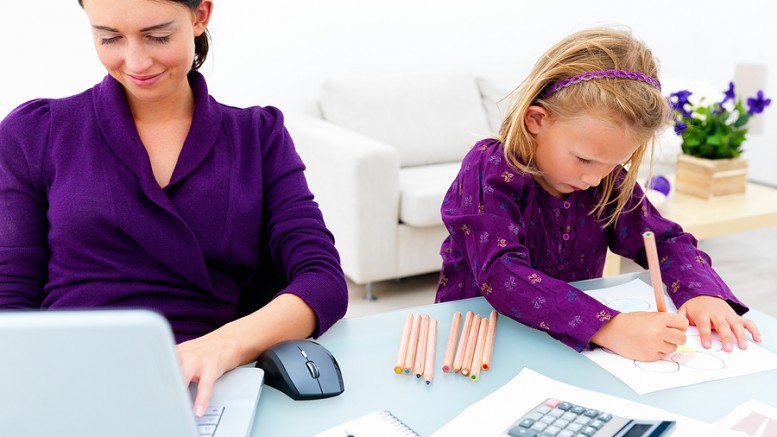 Young woman or mother working from home