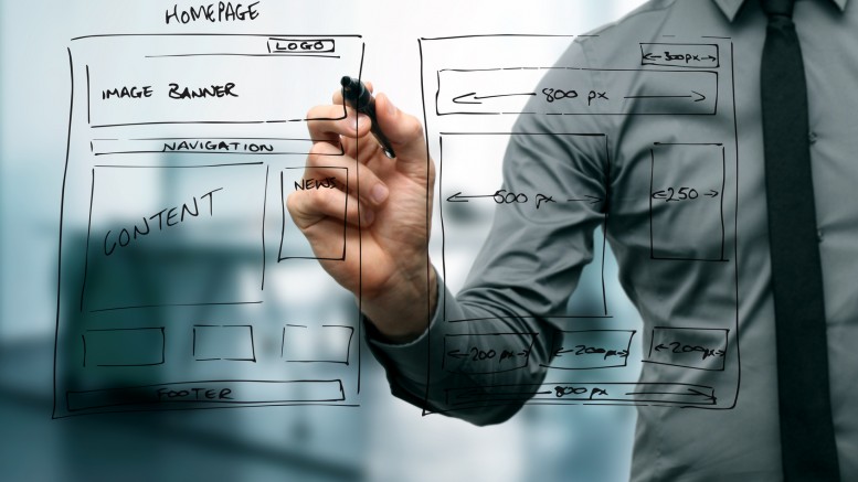 designer drawing website development wireframe