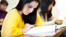 college students studying in classroom