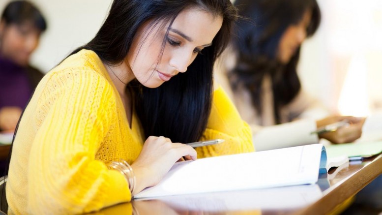 college students studying in classroom