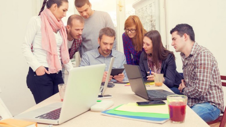 Young group of people discussing business plans.