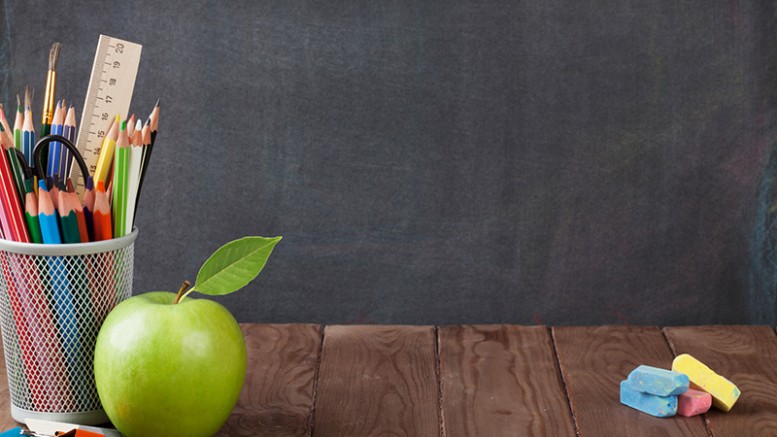 School and office supplies on classroom table