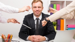 Man at the office having a lot of work