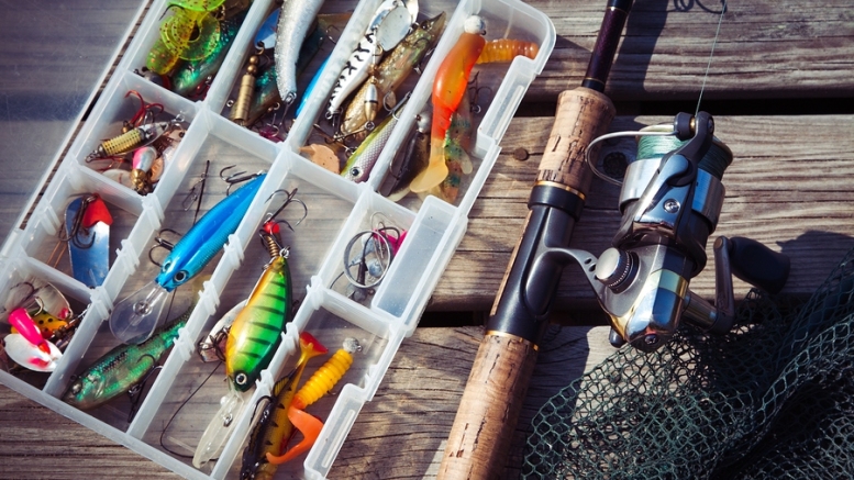 Fishing Lures In Tackle Boxes With Spinning Rod And Net