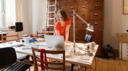 woman-working-in-home-office-file-cabinet-getty_573x300