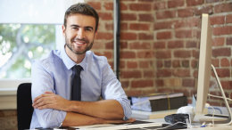 Man Working At Computer In Contemporary Office