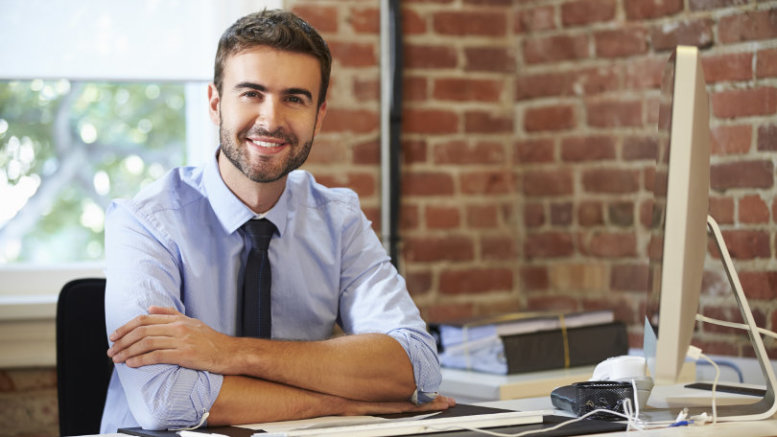 Man Working At Computer In Contemporary Office