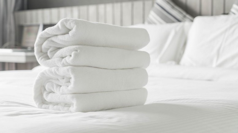 White towel on bed decoration in bedroom interior - Vintage light Filter